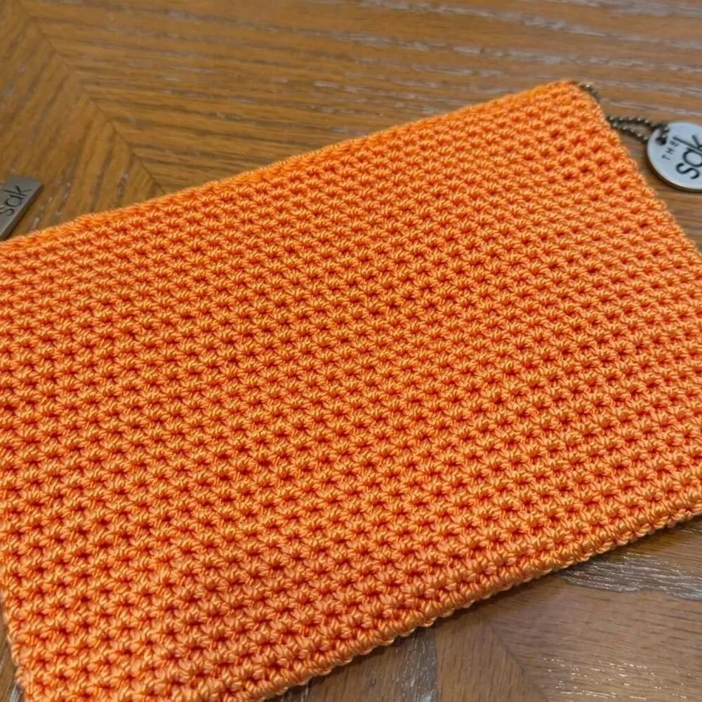 The Sak Crochet Orange Cosmetic Pouch Bag